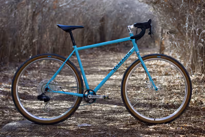 Baby blue steel gravel bike with steel fork