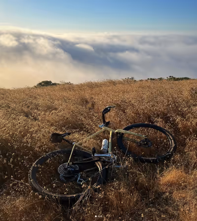 Yellow gravel bike viewing San Francisco fog.