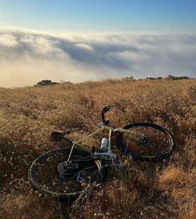 Yellow gravel bike viewing San Francisco fog.